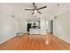 Open-concept living room with hardwood floors and a ceiling fan at 1000 W Horatio St # 327, Tampa, FL 33606