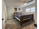 Comfortable bedroom featuring new floors, a ceiling fan, and a window at 11485 Oakhurst Rd # 1200-2, Largo, FL 33774