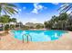 The inviting community pool is surrounded by lush landscaping and lounging areas, perfect for relaxation and recreation at 12402 Country White Cir, Tampa, FL 33635