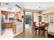 Bright dining area featuring wood floors, with a view of the backyard at 12402 Country White Cir, Tampa, FL 33635