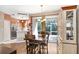 Cozy dining area featuring wood floors, with a view of the backyard at 12402 Country White Cir, Tampa, FL 33635