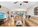 Bright living room featuring hardwood floors and a cozy seating area at 12402 Country White Cir, Tampa, FL 33635