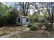 Backyard shed with an adjacent small dog house at 13924 Morgan St, Dade City, FL 33525