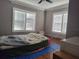 Bedroom featuring natural light, hardwood floors and neutral wall paint, creating a comfortable atmosphere at 14124 Plum Ln, Hudson, FL 34667