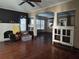 Open living room features hardwood floors, fireplace, with bright and open archways at 14124 Plum Ln, Hudson, FL 34667