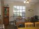 Dining Room with natural light, table with seating, and hardwood floors at 1440 Hales Hollow Dr, Dunedin, FL 34698