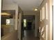 Hallway featuring neutral colored walls and trim at 1440 Hales Hollow Dr, Dunedin, FL 34698