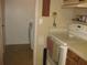 Easy access laundry area off kitchen, with washer and dryer at 1440 Hales Hollow Dr, Dunedin, FL 34698