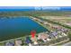 Aerial view of waterfront community with a lake and stunning waterfront houses at 1604 Mira Lago Cir, Ruskin, FL 33570