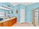 Bright bathroom with double sinks, walk-in shower and separate tub at 1604 Mira Lago Cir, Ruskin, FL 33570