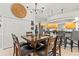 Dining area with seating for six near an open-concept kitchen at 18836 Autumn Lake Blvd, Hudson, FL 34667