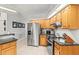 Well-equipped kitchen featuring stainless steel appliances and modern cabinetry at 18836 Autumn Lake Blvd, Hudson, FL 34667