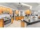 Spacious kitchen area featuring stainless steel appliances and ample countertops at 18836 Autumn Lake Blvd, Hudson, FL 34667