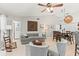 Spacious living room featuring neutral tones, tile floors, comfortable seating, and decorative elements for a cozy ambiance at 18836 Autumn Lake Blvd, Hudson, FL 34667