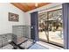 Enclosed patio with dog kennels, a sliding glass door, and outdoor furniture by the pool at 18836 Autumn Lake Blvd, Hudson, FL 34667