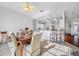 Open dining area with a breakfast bar and view to the kitchen at 2011 Captiva Ct, Sun City Center, FL 33573