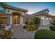 Well-maintained home featuring a decorative glass front door, two-car garage and manicured landscaping at 2011 Captiva Ct, Sun City Center, FL 33573