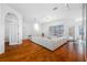 Bright living room featuring hardwood floors and sliding doors at 2011 Captiva Ct, Sun City Center, FL 33573