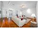 Bright open-concept living room featuring hardwood floors and decorative lighting at 2011 Captiva Ct, Sun City Center, FL 33573