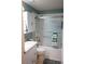 Clean and modern bathroom with a shower over tub and vanity at 2025 Grantham Greens Dr # 52, Sun City Center, FL 33573