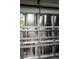 Insulated silver-colored garage door interior with metal hardware at 2025 Grantham Greens Dr # 52, Sun City Center, FL 33573