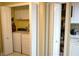 Convenient laundry area with washer, dryer, and storage shelving at 2025 Grantham Greens Dr # 52, Sun City Center, FL 33573