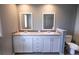 Bathroom featuring a double sink vanity, countertops, and tiled floors at 204 El Prado, North Port, FL 34287