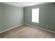 Bedroom with light gray walls, plush carpeting, and bright window at 204 El Prado, North Port, FL 34287