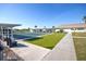 Well-maintained putting green area with artificial turf, flags, and seating for players at 204 El Prado, North Port, FL 34287