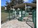 Entrance to community dog park features separate areas for small and large dogs at 2330 Ecuadorian Way # 10, Clearwater, FL 33763