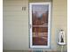 Close up of the front door of the home with glass paneling, and the number 10 on the house at 2330 Ecuadorian Way # 10, Clearwater, FL 33763