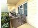 A cozy patio setup with chairs and table outside of the unit with small plants at 2330 Ecuadorian Way # 10, Clearwater, FL 33763