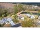 Aerial view of home showcasing lush landscaping and a beautiful backyard pond at 29447 Schinnecock Hills Ln, San Antonio, FL 33576