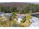 Aerial view of home showcasing lush landscaping and a beautiful backyard pond at 29447 Schinnecock Hills Ln, San Antonio, FL 33576