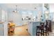 Bright kitchen with white cabinetry, modern appliances, and a breakfast bar with stools at 29447 Schinnecock Hills Ln, San Antonio, FL 33576