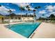 Beautifully maintained swimming pool area with clear blue water and well-kept landscaping at 29447 Schinnecock Hills Ln, San Antonio, FL 33576