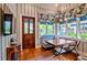 Cozy dining area with lots of light featuring a quaint wooden table at 3005 S Miller Rd, Valrico, FL 33596