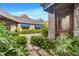 An elegant stone home with awning-covered windows and meticulous landscaping at 3005 S Miller Rd, Valrico, FL 33596