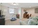 Bedroom featuring a couch, desk, and a window for natural light at 3213 W Cass St, Tampa, FL 33609