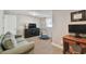 Bedroom featuring a couch, desk, and a window for natural light at 3213 W Cass St, Tampa, FL 33609