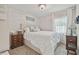 Serene bedroom with a luxurious bed, elegant lighting, and bedside tables at 3213 W Cass St, Tampa, FL 33609