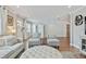 Open-concept living room featuring wood floors, recessed lighting, and neutral-toned furniture at 3213 W Cass St, Tampa, FL 33609