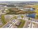 Aerial view of a residential community showcasing the neighborhood's layout, surrounding lakes, and convenient parking at 33065 Major Oak Dr, Wesley Chapel, FL 33545