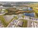 Aerial view of a residential community showcasing the neighborhood's layout, surrounding lakes, and convenient parking at 33065 Major Oak Dr, Wesley Chapel, FL 33545