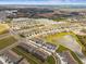 Aerial view of a residential community showcasing the neighborhood's layout, surrounding lakes, and convenient parking at 33065 Major Oak Dr, Wesley Chapel, FL 33545