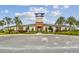 Community clubhouse with welcoming entrance, beautiful landscaping, and ample parking, perfect for community events and gatherings at 33065 Major Oak Dr, Wesley Chapel, FL 33545