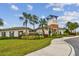 Community clubhouse with lush landscaping, inviting pathway and manicured lawn, perfect for community events and gatherings at 33065 Major Oak Dr, Wesley Chapel, FL 33545