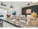 Close-up of the kitchen island with granite countertops and stainless steel sink, blending style and functionality at 33065 Major Oak Dr, Wesley Chapel, FL 33545