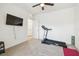 Functional workout room features a treadmill and mounted TV at 33065 Major Oak Dr, Wesley Chapel, FL 33545