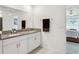 Bright bathroom featuring double sinks, granite counters, and a modern design at 36642 Garden Wall Way, Zephyrhills, FL 33541